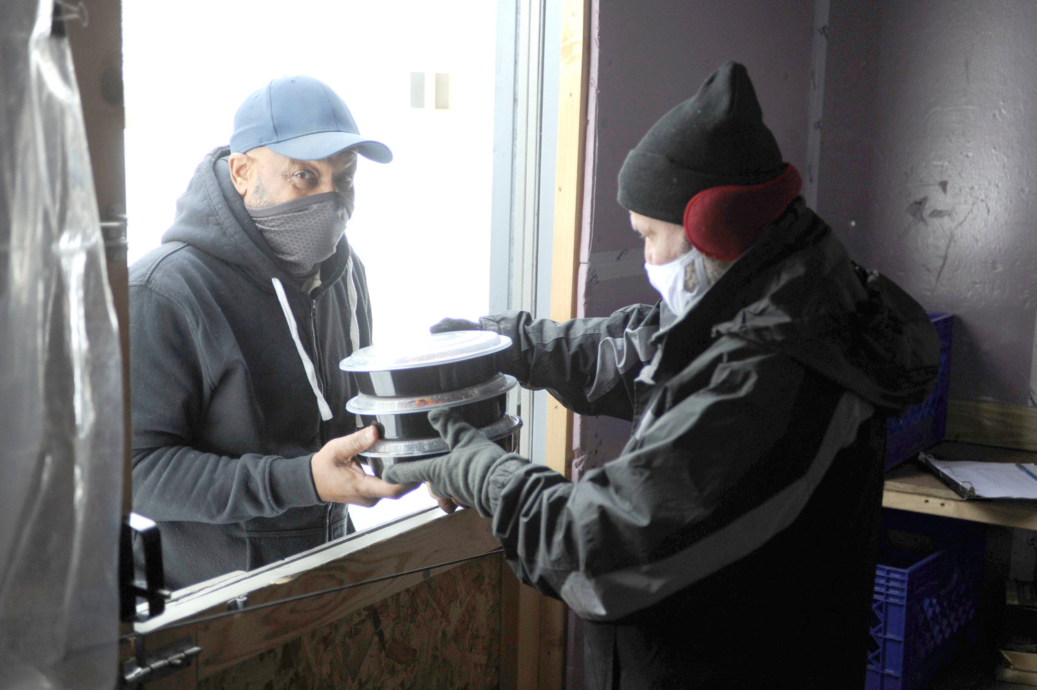 Angel Rodriguez, the Federation’s stock clerk, stated out as a volunteer in 2009 and was promoted a few years later. He is pictured handing out several containers of hot food to someone in need.